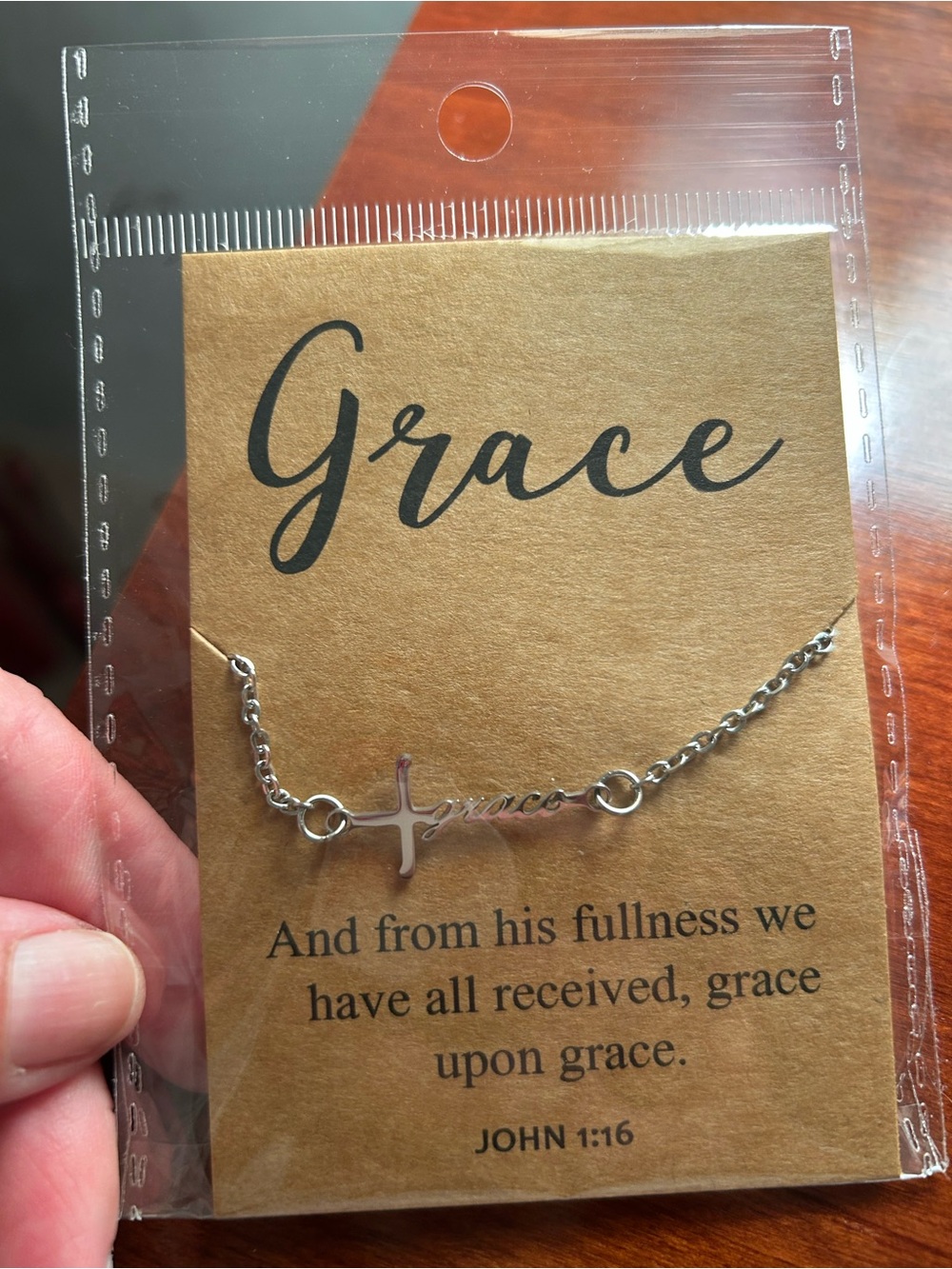 Grace Silver Cross Script Bracelet on Brown Card